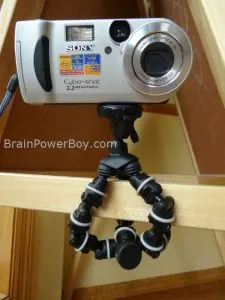 Dynex Flexible Tripod with Sony Cybershot Camera wrapped around board