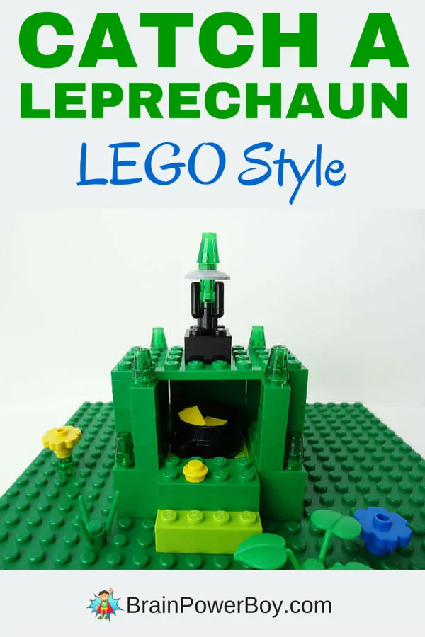 A Leprechaun trap made from Legos, using green legos, yellow lego flowers, blue lego flowers, and green lego plants.