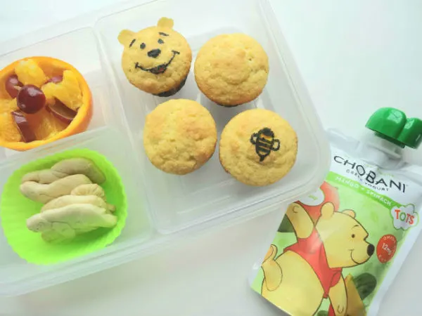 Tots are going to love this Winnie the Pooh lunch with super cute Pooh and bee corn muffins! Add fresh fruit, a few animal crackers, and a Chobani Tots Greek Yogurt Mango + Spinach pouch, made with real fruits and veggies for the best lunch this side of The Hundred Acre Wood. Created by BrainPowerBoy.com, sponsored by Chobani.