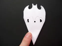 Punch holes under the Batman snowflake pattern