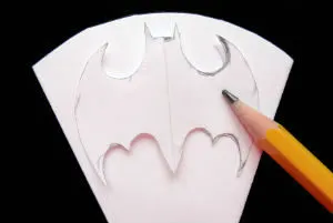 Trace Batman snowflake template onto snowflake