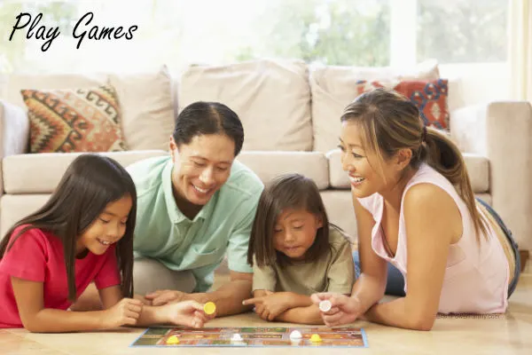 family playing a board game together at home
