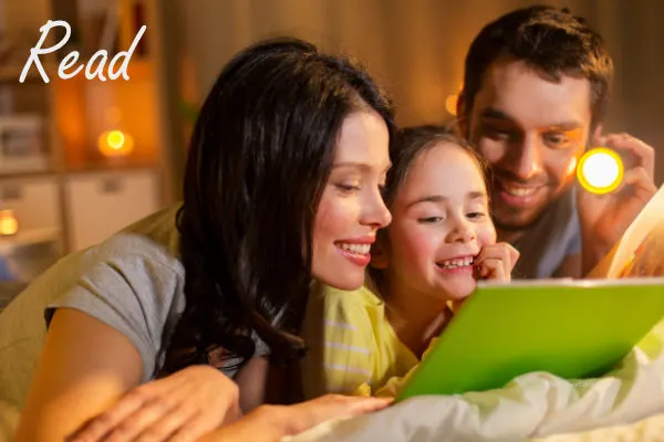 family reading books together at night
